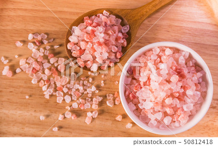 Pink salt from Bolivian in spoon on wooden plate 50812418