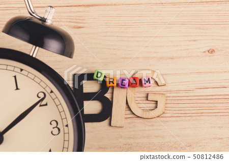 colorful cubes with word DREAM BIG on wooden desk colorful cubes with word DREAM BIG on wooden desk 50812486