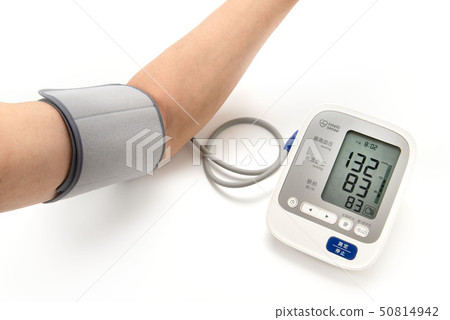 Male arm measuring blood pressure with home sphygmomanometer Male arm measuring blood pressure with home sphygmomanometer 50814942