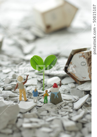 A town and people with green and flowers regenerated from the rubble after the disaster 50815107