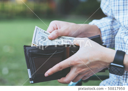 close up young man Person holding a wallet 50817950