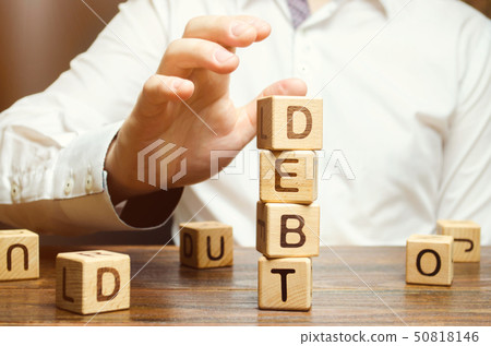 Businessman removes wooden blocks  50818146