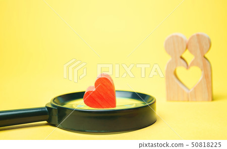 Heart, magnifying glass and a couple in love. Heart, magnifying glass and a couple in love. 50818225