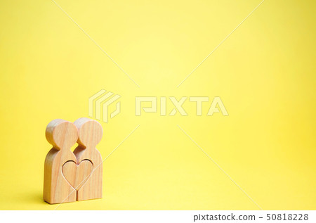 A couple in love and a heart between them. A couple in love and a heart between them. 50818228