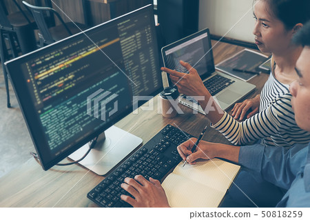 Programmer working in a software development and Programmer working in a software development and 50818259