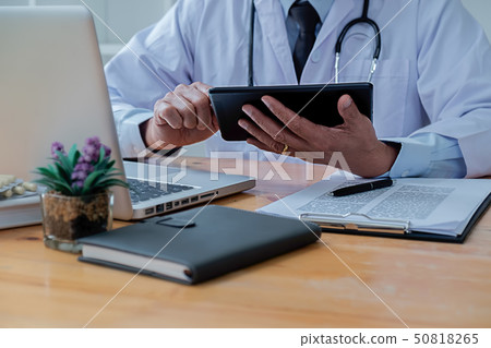 Patient listening intently to a male doctor 50818265