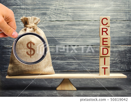 Money bag and wooden blocks with the word Credit Money bag and wooden blocks with the word Credit 50819042