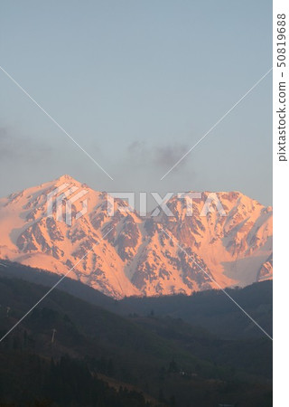 View of Hakuba from Hakuba Village in Hakuba-dake and Mt. Shishi-dake in Northern Alps Hakuba-san, which is dyed to the morning glow View of Hakuba from Hakuba Village in Hakuba-dake and Mt. Shishi-dake in Northern Alps Hakuba-san, which is dyed to the morning glow 50819688