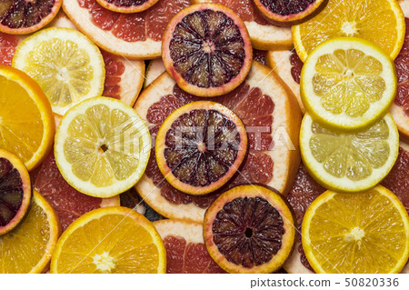 Background from sliced citrus oranges grapefruit l Background from sliced citrus oranges grapefruit l 50820336