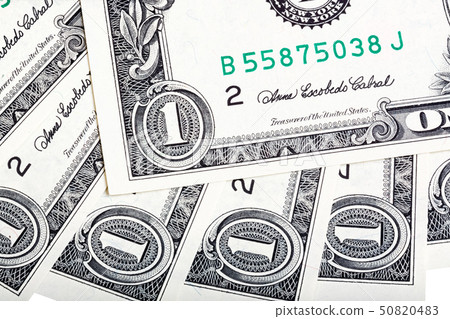 A background with american one dollar bills. Close-up photo. A background with american one dollar bills. Close-up photo. 50820483