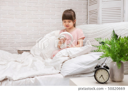 little child girl with the headphones little child girl with the headphones 50820669