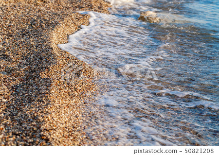 Summer sunrise on coast, Corfu island, Greece. Beach with Sunbeds and umbrellas with perfect views 50821208