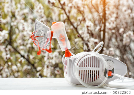 Nebulizer with a mask on the background of a 50822803