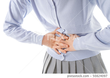 A young woman suffering from abdominal pain 50824097