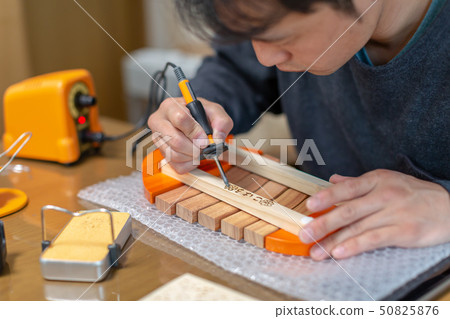 Wood burning 50825876