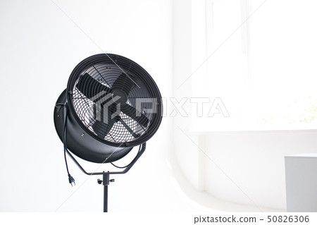 Black powerful fan in the white room. Studio isolated. Black powerful fan in the white room. Studio isolated. 50826306