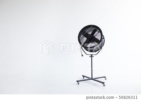 Black powerful fan in the white room. Studio isolated. Black powerful fan in the white room. Studio isolated. 50826311