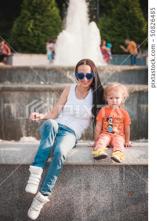 Happy mother with son outdoor 50826485