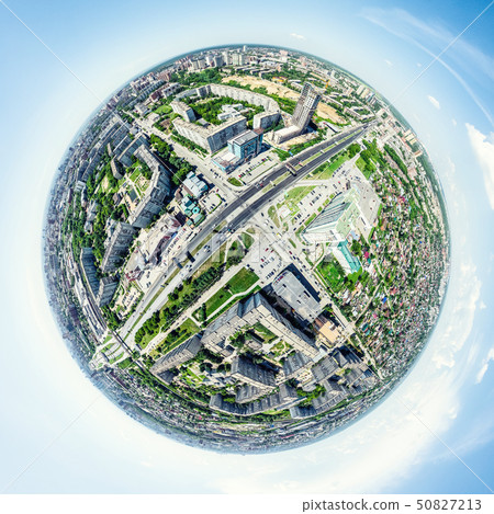 Aerial city view with crossroads and roads, houses, buildings, parks and parking lots. Sunny summer Aerial city view with crossroads and roads, houses, buildings, parks and parking lots. Sunny summer 50827213