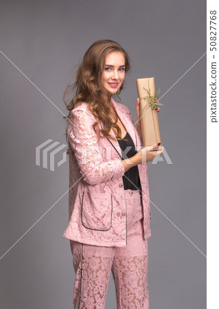 Portrait of a happy woman with gift box  50827768