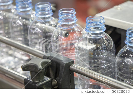 The water bottles in the conveyor belt. The water bottles in the conveyor belt. 50828053
