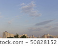 Dramatic evening blue sky with clouds over the city, background 50828152