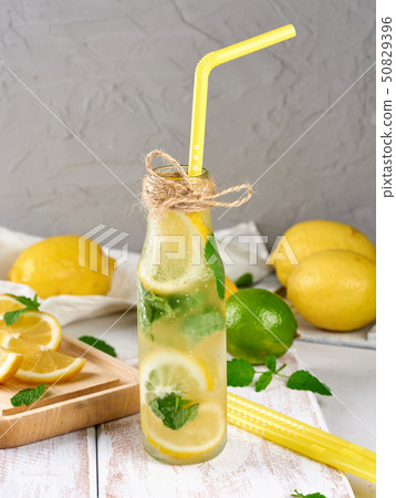 cold drink with lemons, mint leaves, lime in a 50829396