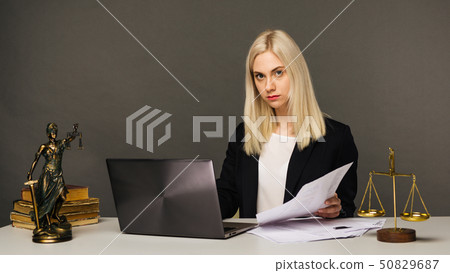 Portrait of smiling businesswoman looking at 50829687