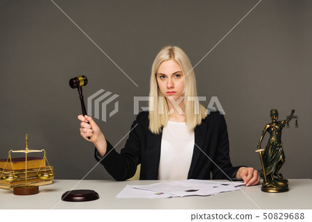 Female lawyer working at table in office 50829688