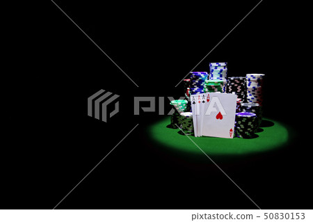Four Aces with chip stack on green Table Four Aces with chip stack on green Table 50830153