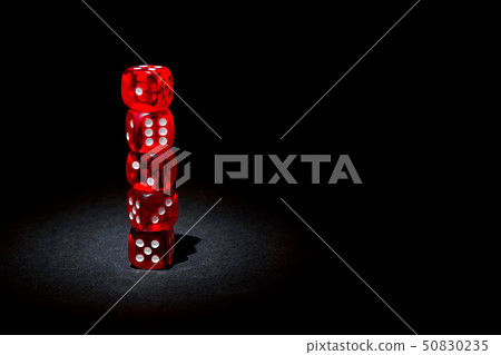 Red dices for gambling on a black background 50830235