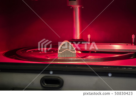 Object printed from metal powder on metal 3d printer, working chamber. 50830423