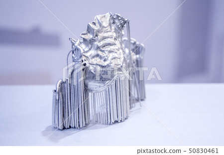 Dental crowns printed in laser sintering machine. Modern 3D printer 50830461