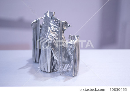 Dental crowns printed in laser sintering machine. Modern 3D printer Dental crowns printed in laser sintering machine. Modern 3D printer 50830463