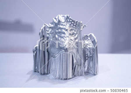 Dental crowns printed in laser sintering machine. Modern 3D printer Dental crowns printed in laser sintering machine. Modern 3D printer 50830465
