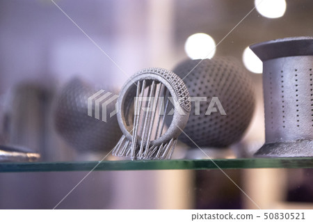 Object printed from metal powder on metal 3d printer. Object printed from metal powder on metal 3d printer. 50830521