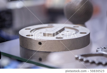 Object printed from metal powder on metal 3d printer. Object printed from metal powder on metal 3d printer. 50830523