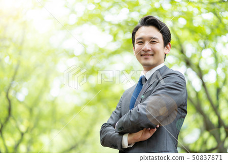 Business man relaxing in the park Business man relaxing in the park 50837871