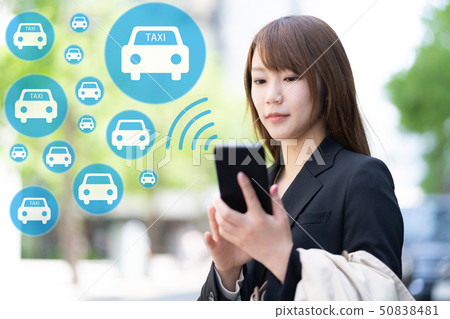 Woman calling a taxi Woman calling a taxi 50838481