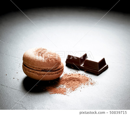Chocolate macaron at the black background Chocolate macaron at the black background 50839715