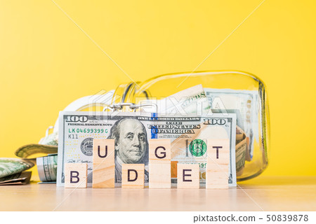 Dollar bills in glass saving bank and word budget 50839878