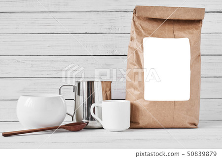 Coffee cup, craft paper bag and stainless pitcher 50839879