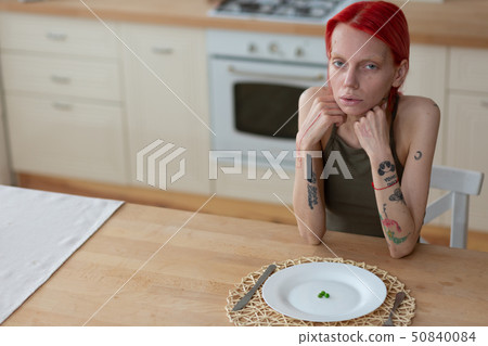 Woman suffering from anorexia having unhealthy look 50840084