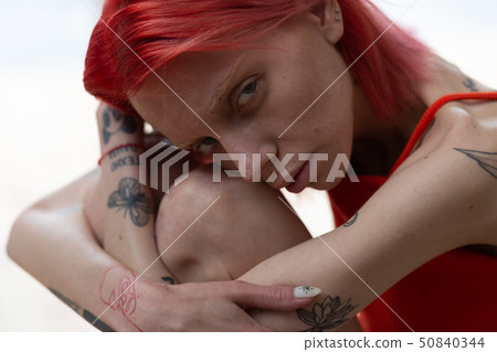 Woman with tattoos feeling bad after strong anorexia Woman with tattoos feeling bad after strong anorexia 50840344