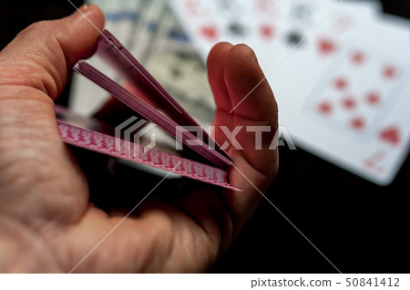 Playing Cards in Male Player Hands. Playing Cards in Male Player Hands. 50841412