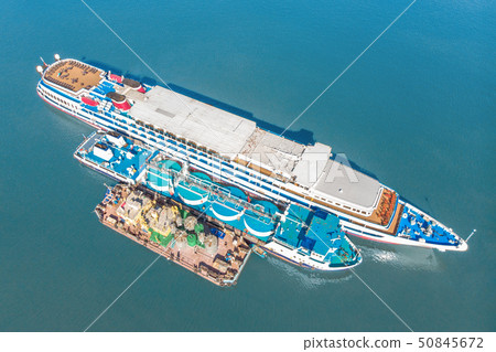 Refueling at sea - Small Oil products ship fuelling a large Bulk carrier, aerial image. Refueling at sea - Small Oil products ship fuelling a large Bulk carrier, aerial image. 50845672