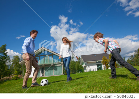 Family playing football 50846323