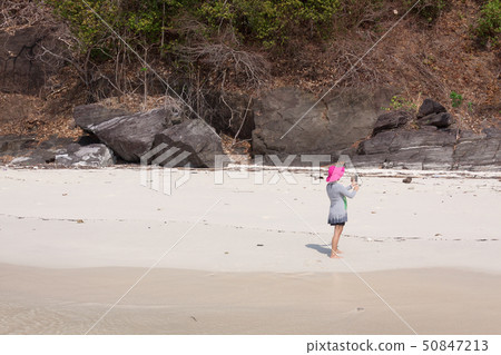 Tourists on the white sand beach Tourists on the white sand beach 50847213