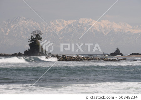 Amaharashi coast overlooking the Tateyama mountain range in the distance 50849234