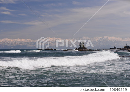 Amaharashi coast overlooking the Tateyama mountain range in the distance Amaharashi coast overlooking the Tateyama mountain range in the distance 50849239